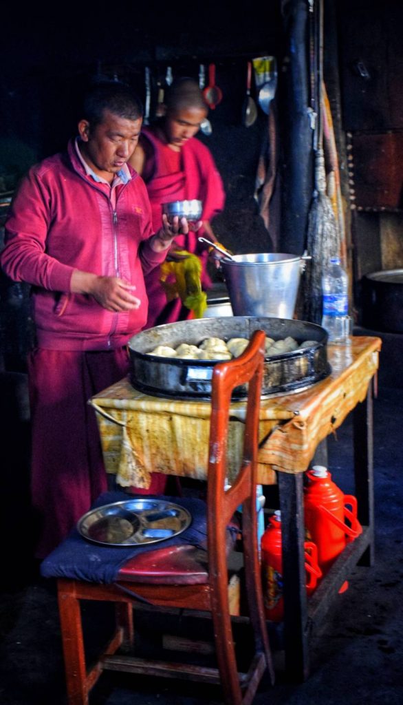 Baking bread in kitchen at Key Monastery